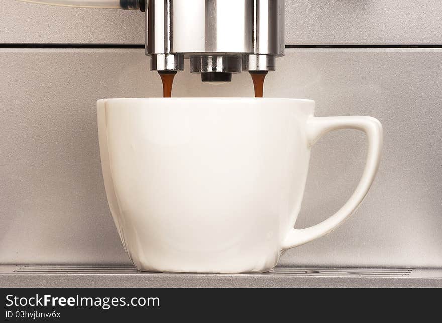 Co0ffee machine with cup of coffee