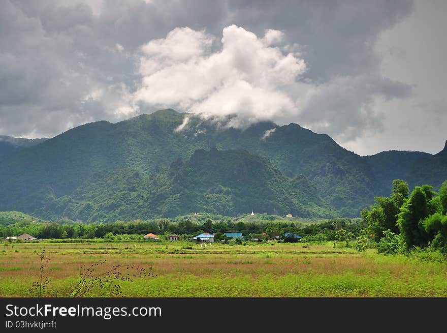 Green mountain with a mist in Thailand.