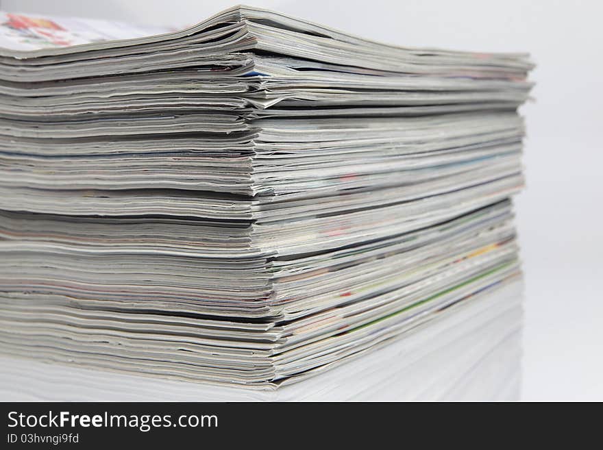 Stack of magazines with reflections