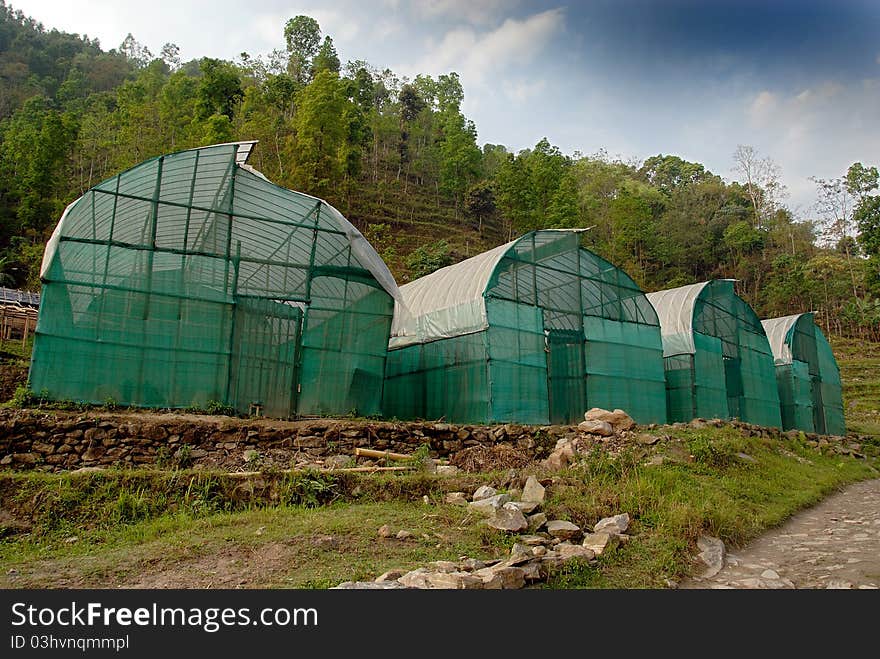 A horizontal view of farmhouse in a mountain village. A horizontal view of farmhouse in a mountain village