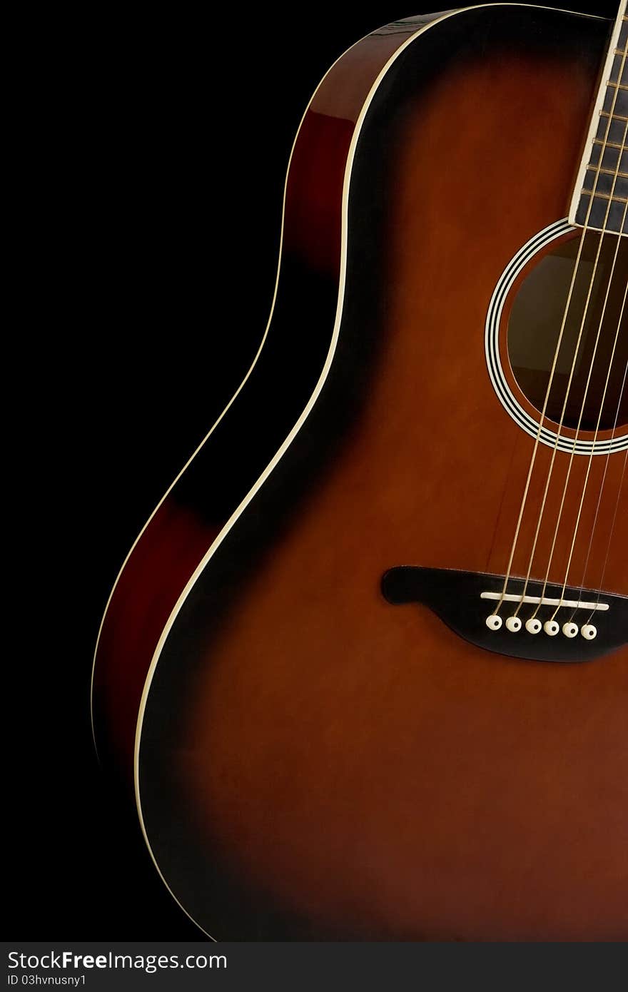 Classical guitar on black background