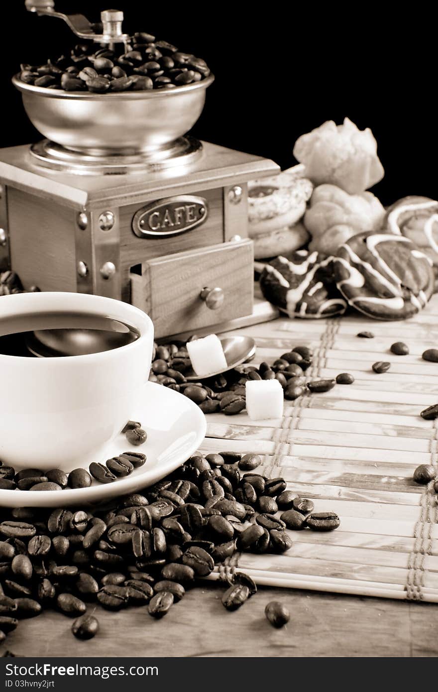 Cup full of coffee, beans, pot and grinder in black and white. Cup full of coffee, beans, pot and grinder in black and white