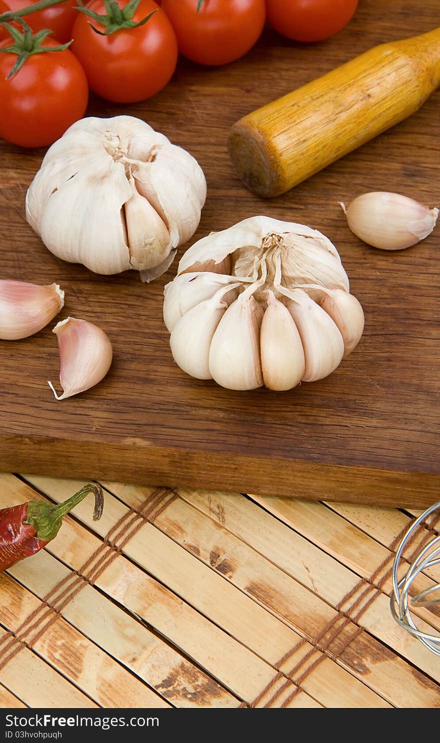 Set of garlic nutrition and healthy food on wood