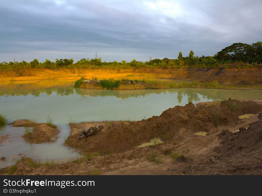 Land and a large pond.