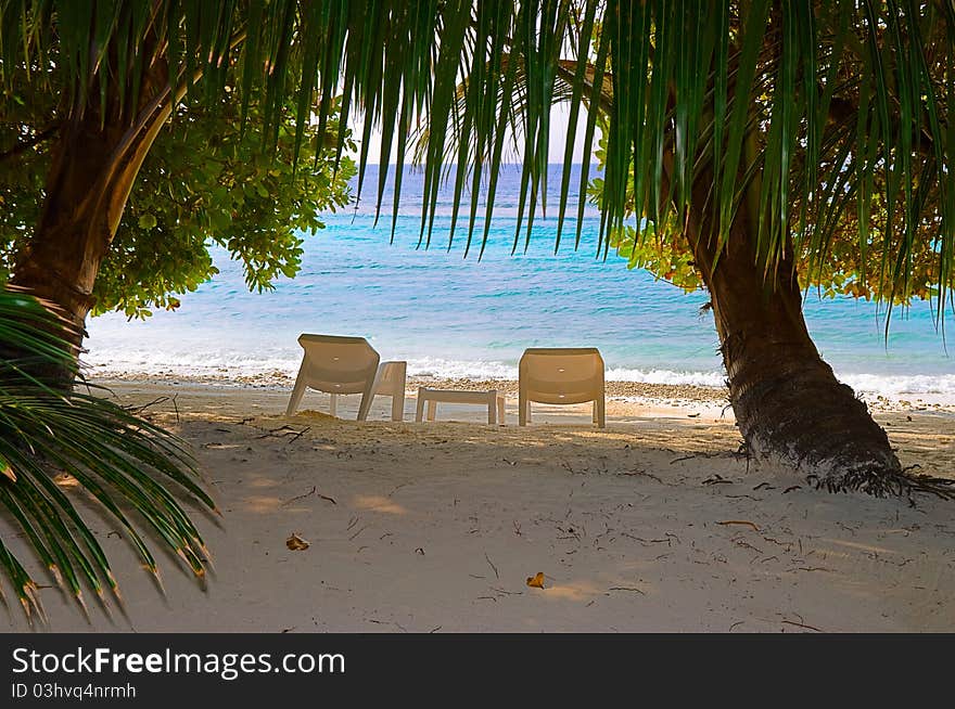 Chairs on tropical beach