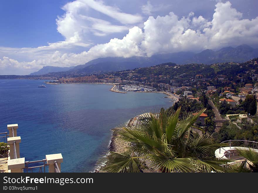 Sunny Riviera coastline with views of the city