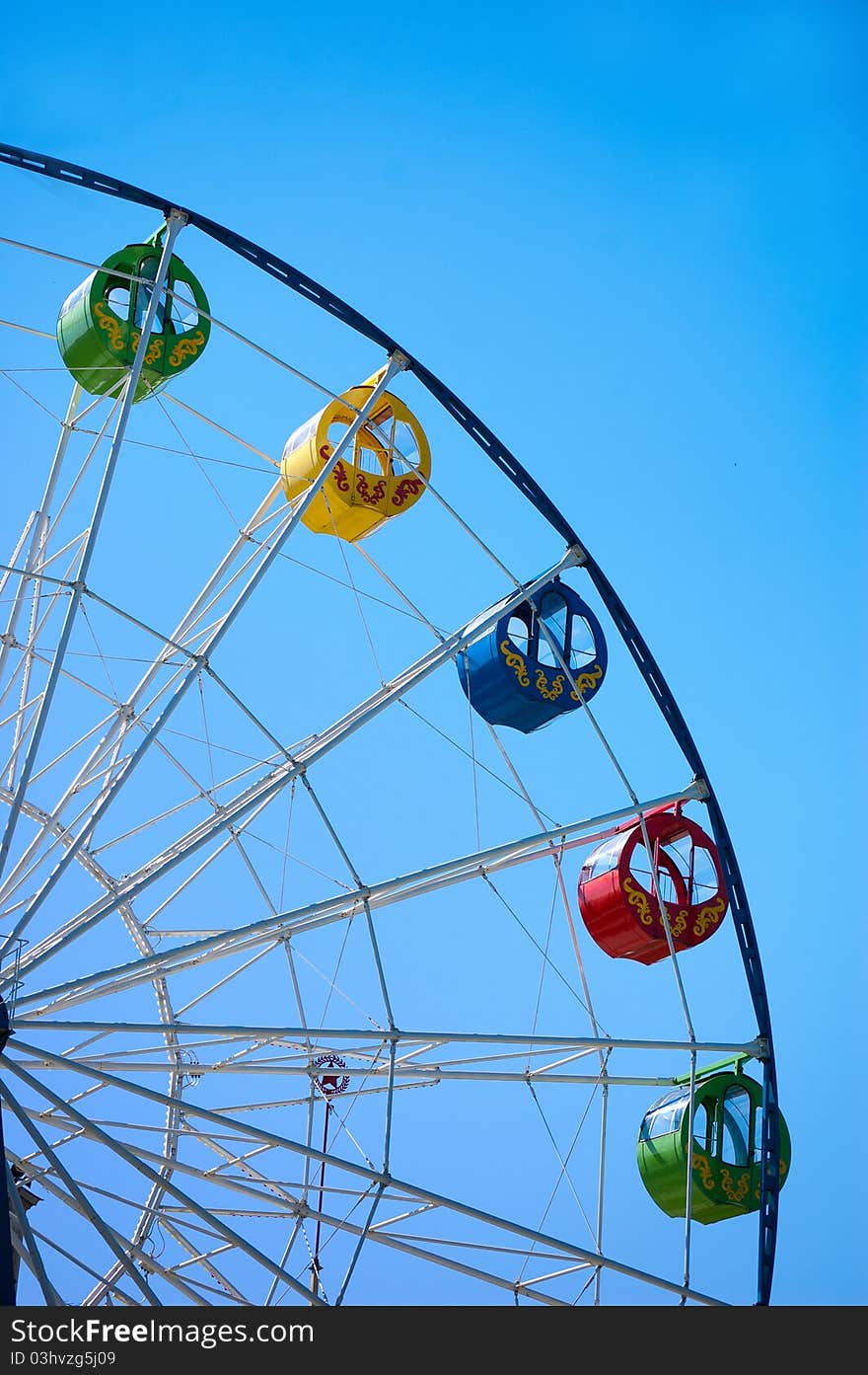 Ferris wheel on blue sky