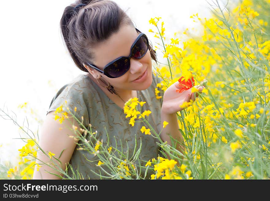 Brunette Girl With A Corn Poppy In Her Hand