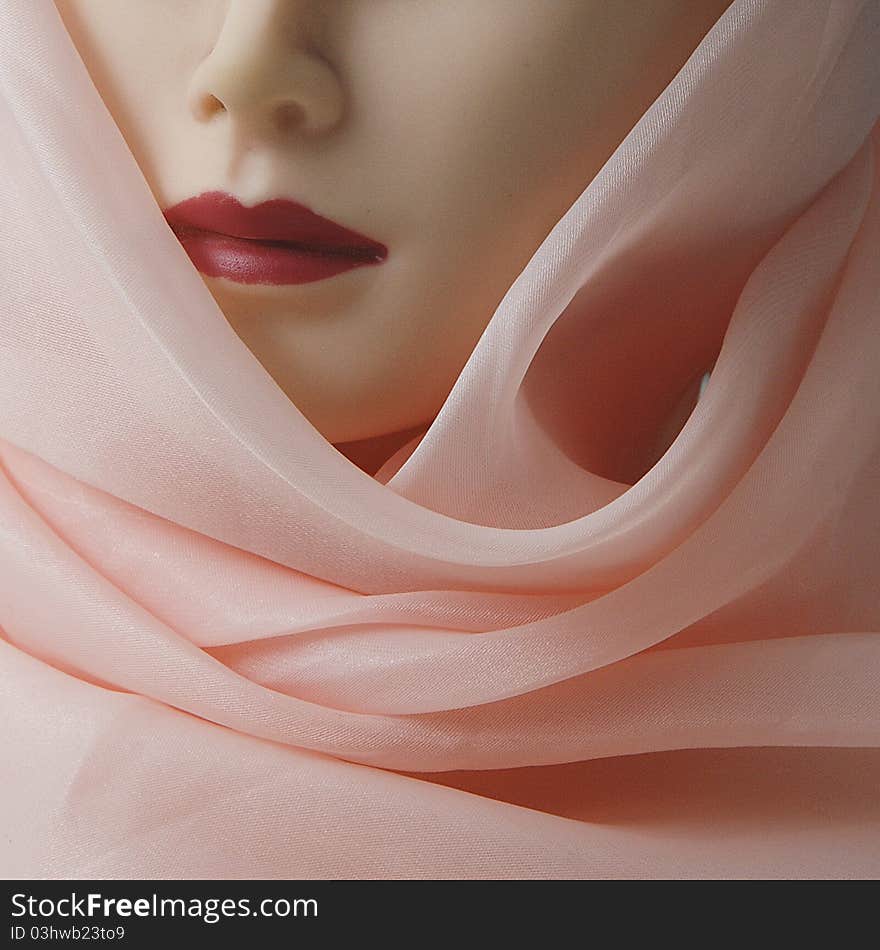 A women model is in pink scarf