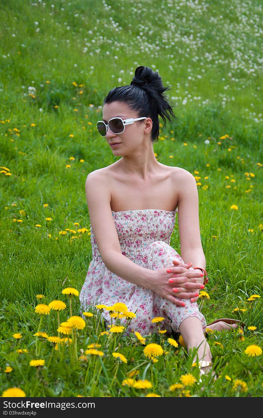 A young girl rests in a park