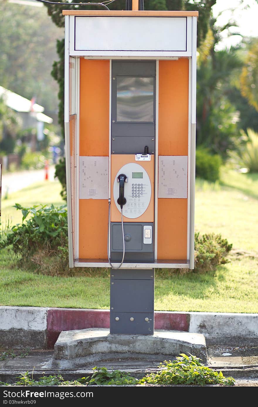 Lonely Orange Public Telephone in Thailand