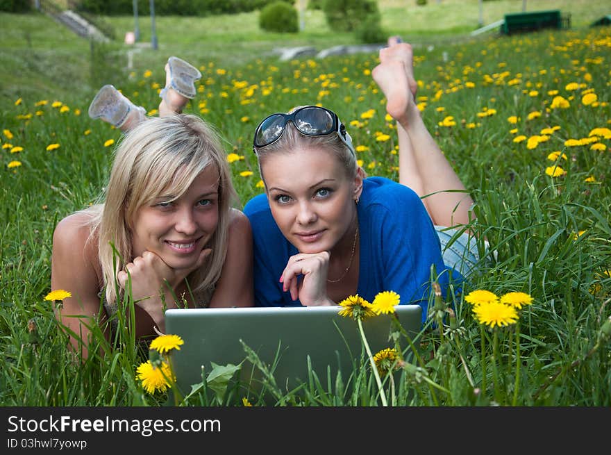 Two girls student with a laptop