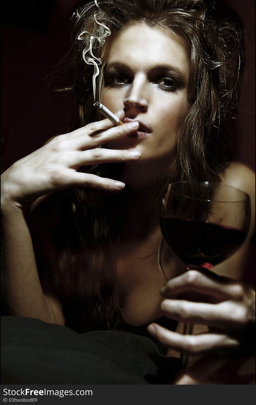 Girl with wineglass and cigarette