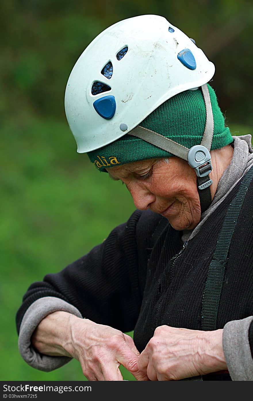 The elderly happy woman-climber