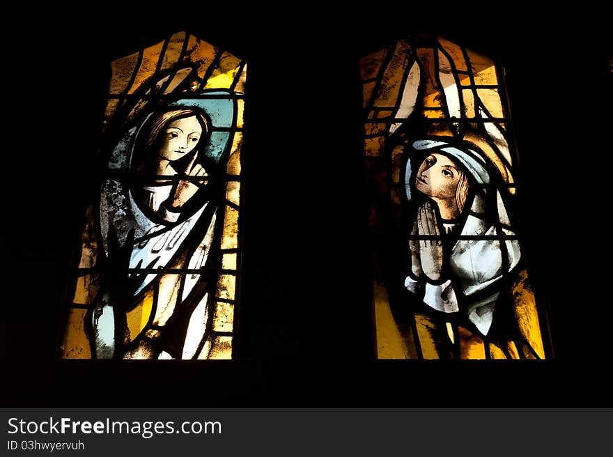 Stained glass windows in the Catholic Church of the Annunciation depict the Archangel Gabriel and Mary.