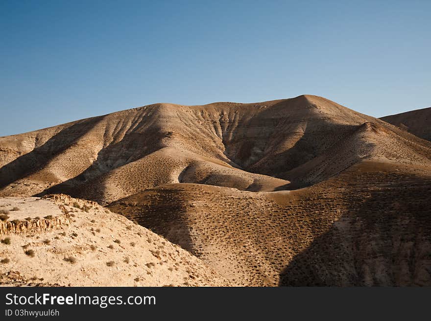 Desert hillsides near Wadi Qelt in the West Bank Jordan Valley desert. Desert hillsides near Wadi Qelt in the West Bank Jordan Valley desert.