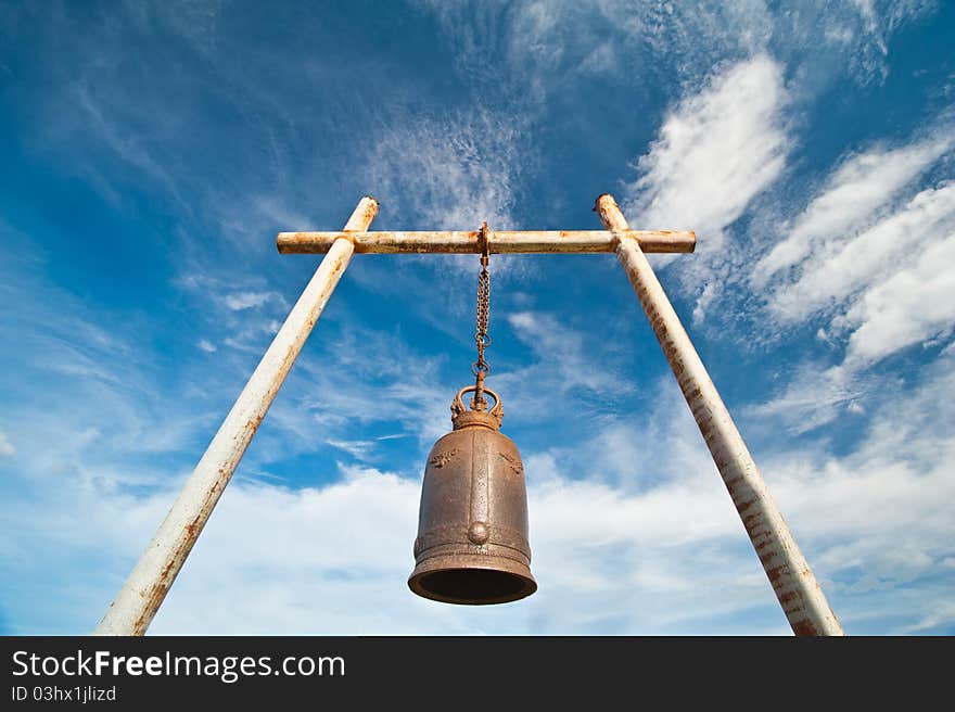 Ancient bell on the mountain with blue sky