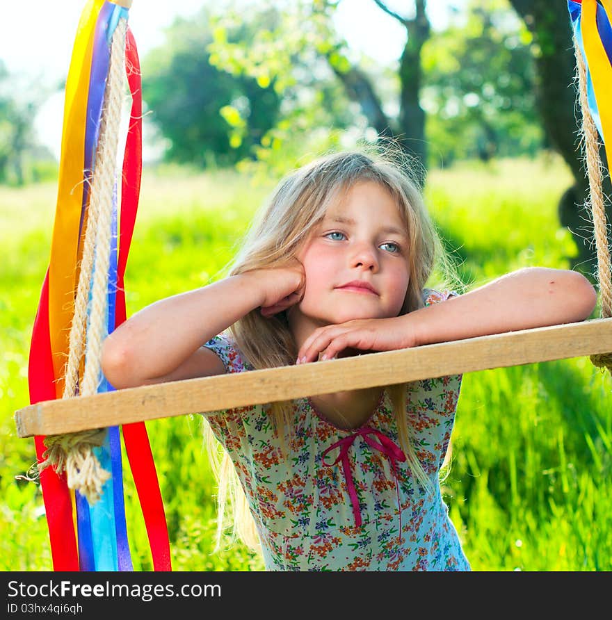 Young girl on swing