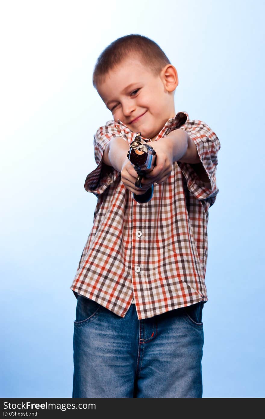 Cute Boy Playing With The Gun