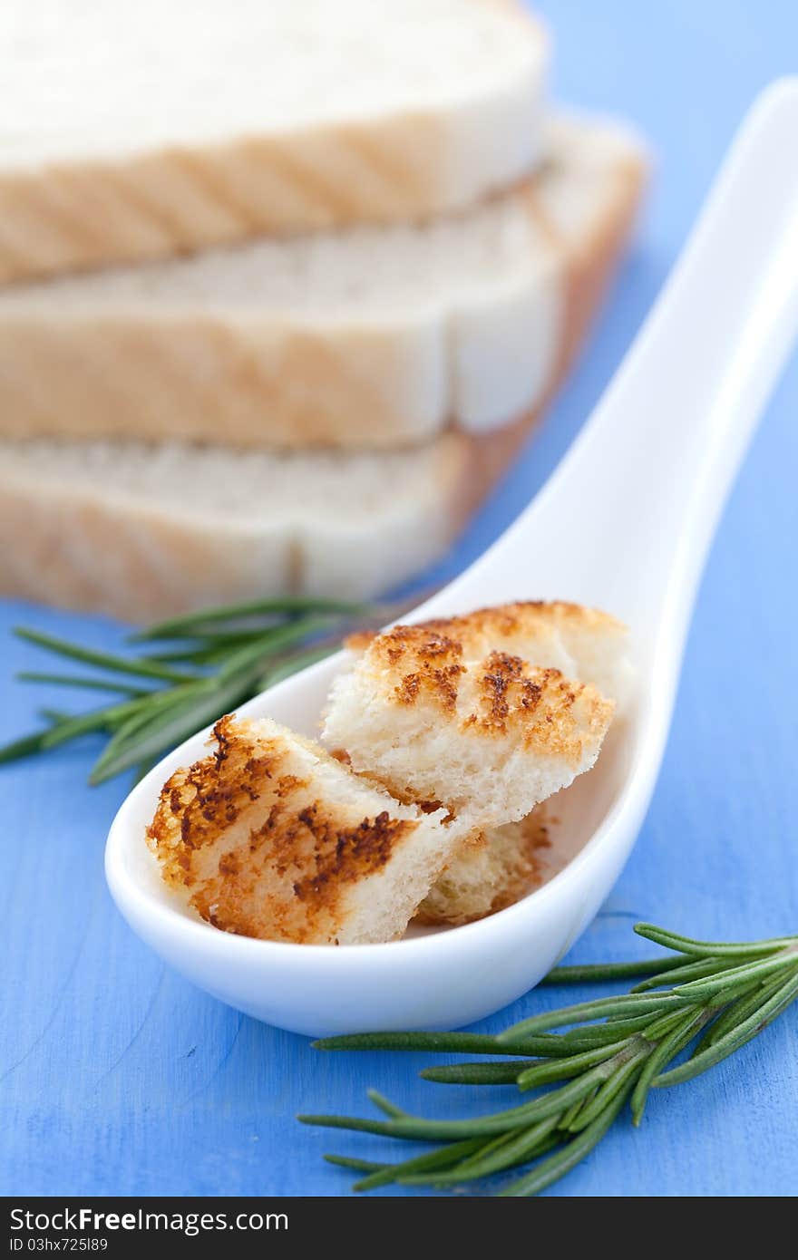 Croutons on spoon