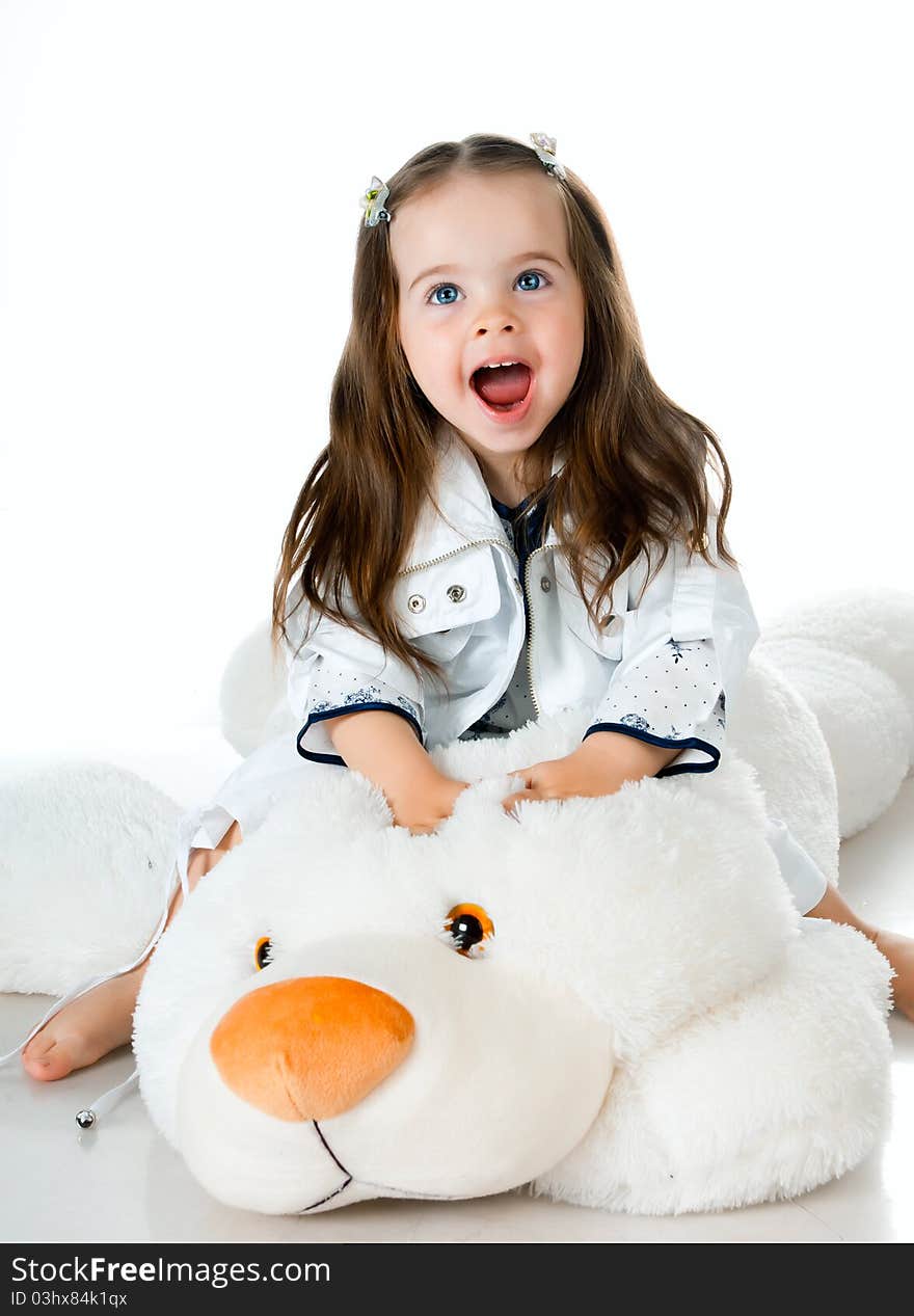 Little girl in studio on white background