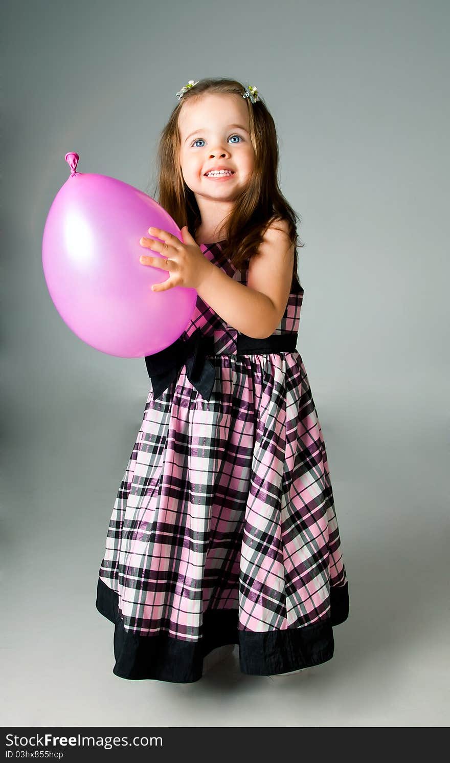 Cute little girl in studio on white background