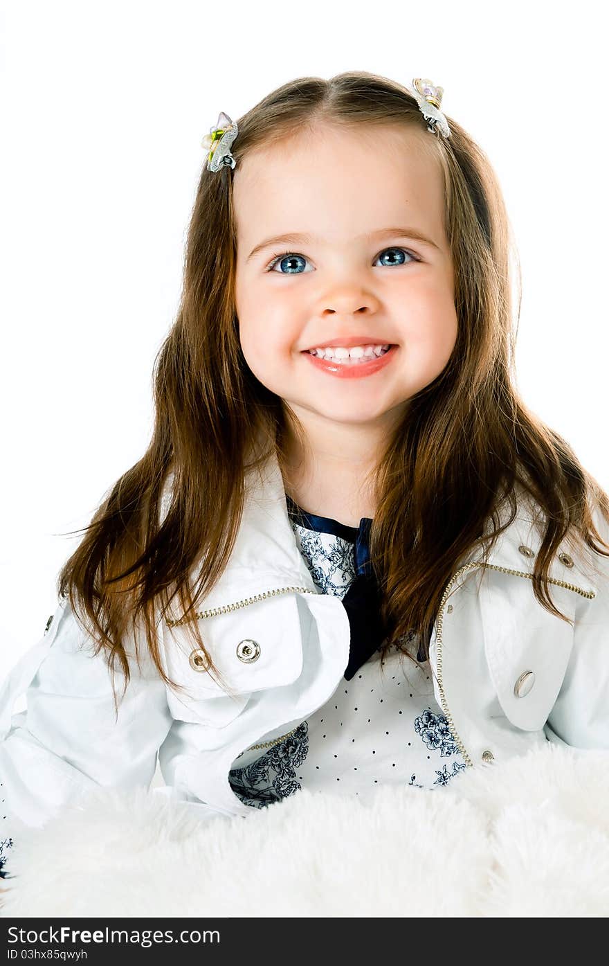 Cute little girl in studio on white background