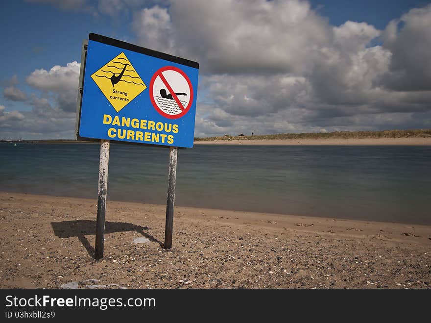 Dangerous currents beach sign with no swimming sign. Dangerous currents beach sign with no swimming sign