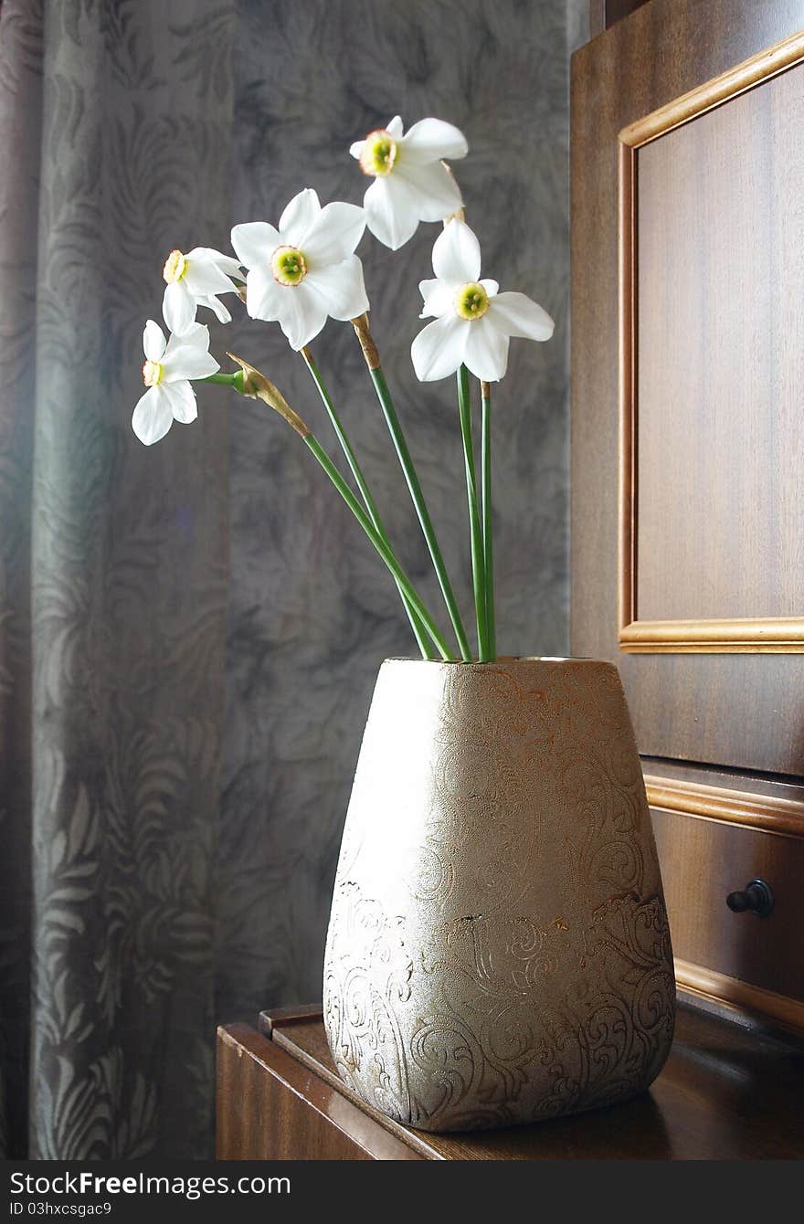 Vase of white daffodils