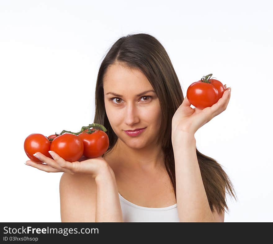 Young woman and fresh tomatoes