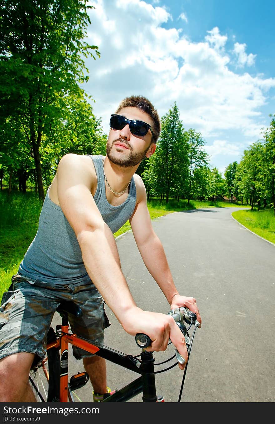 Young man cyclist sitting on bicycle