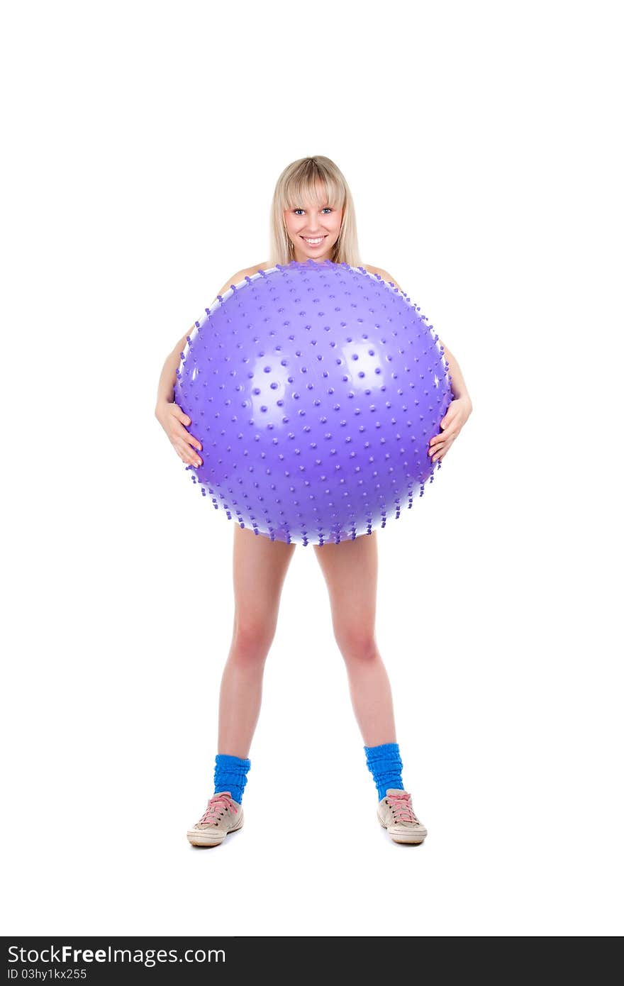 Young woman doing fitness exercise with a violet ball, smile. isolated over white background. Young woman doing fitness exercise with a violet ball, smile. isolated over white background.