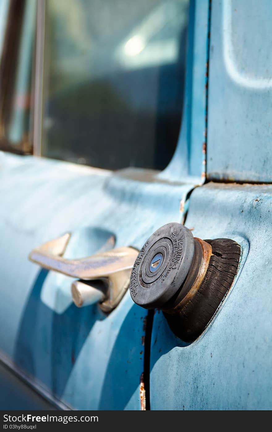 Close-up of an old blue truck fuel cap. Close-up of an old blue truck fuel cap