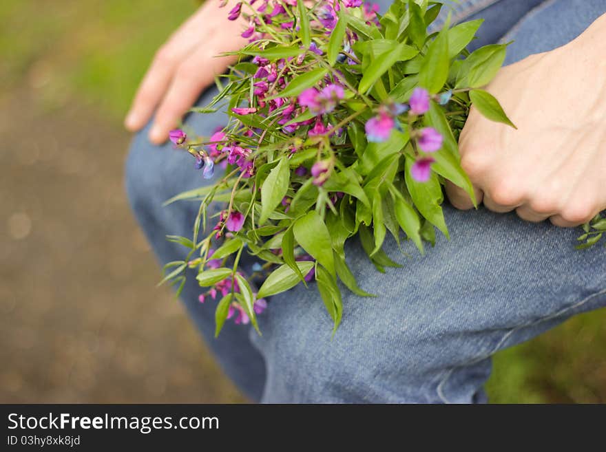 A bouquet of wildflowers in hand