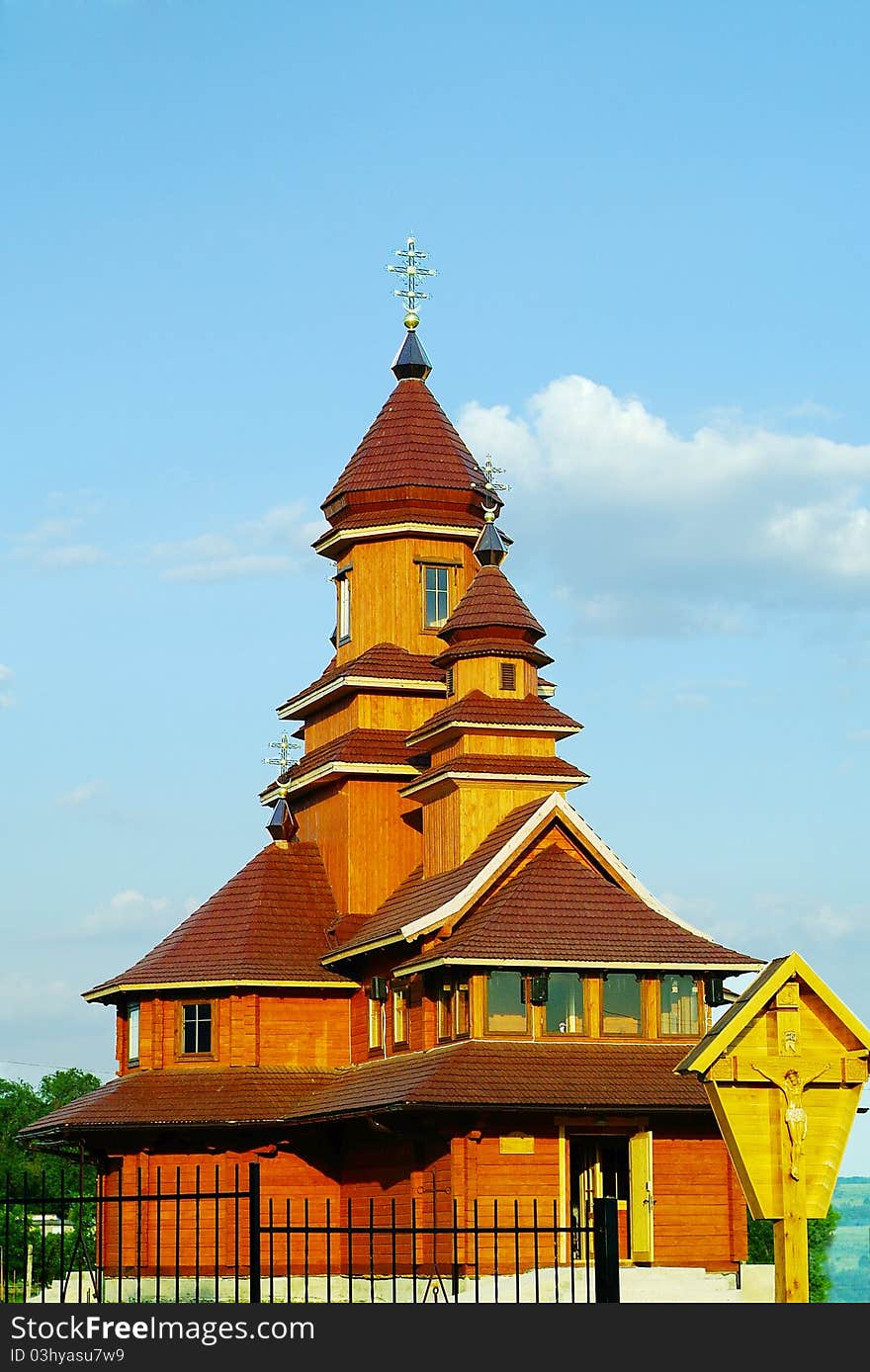 Facade of a building of wooden Catholic church