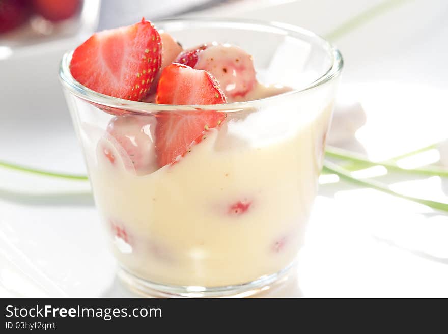 Strawberries served in a glass plate on