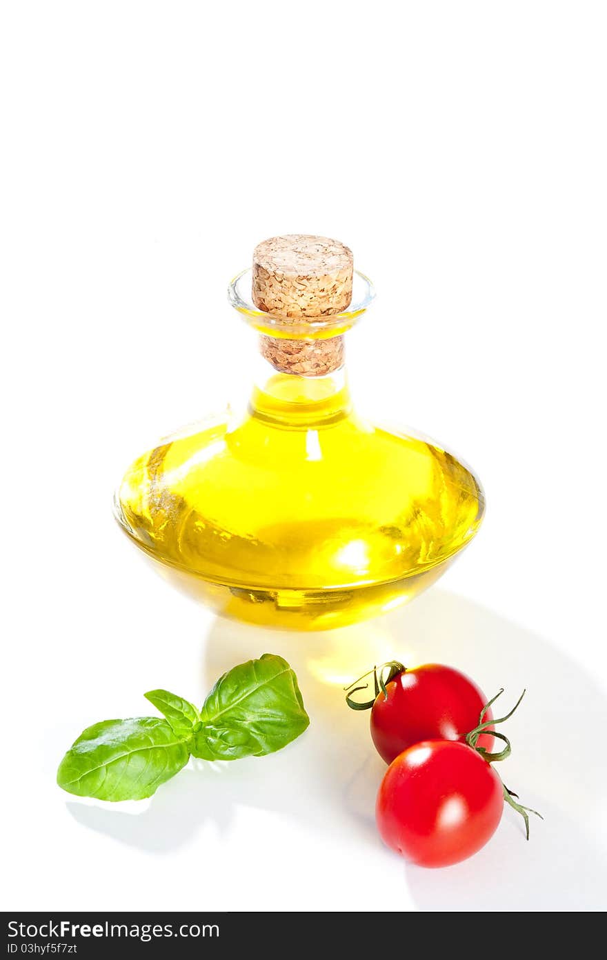 Plate decorated with basil and tomato