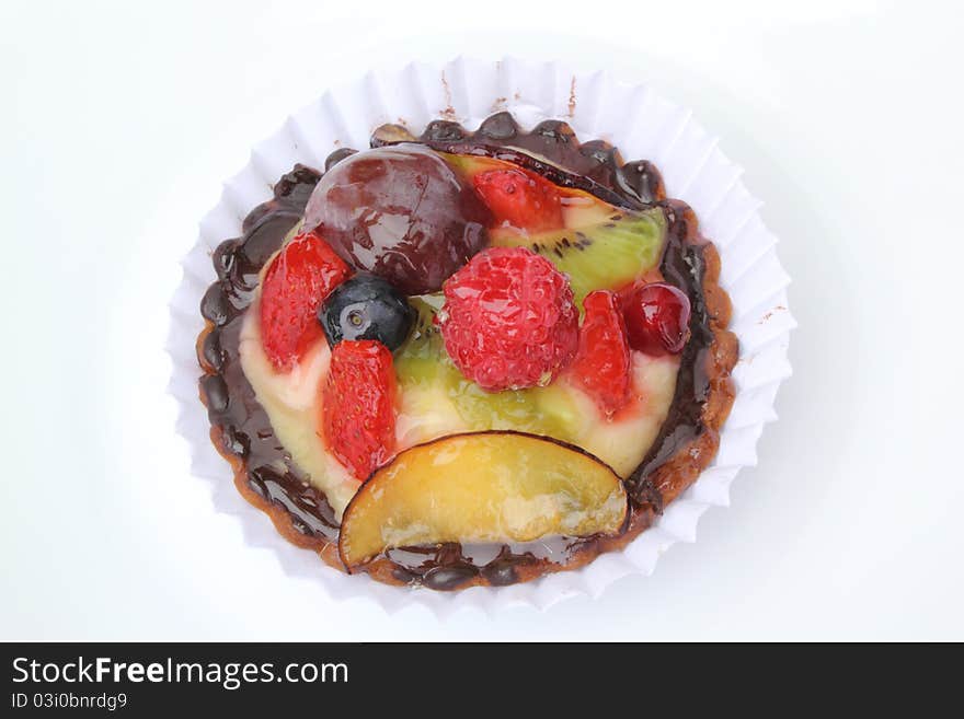 Strawberry tart with caramelized blackberries and blueberries