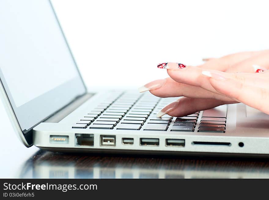 The businesswoman works at the computer at office