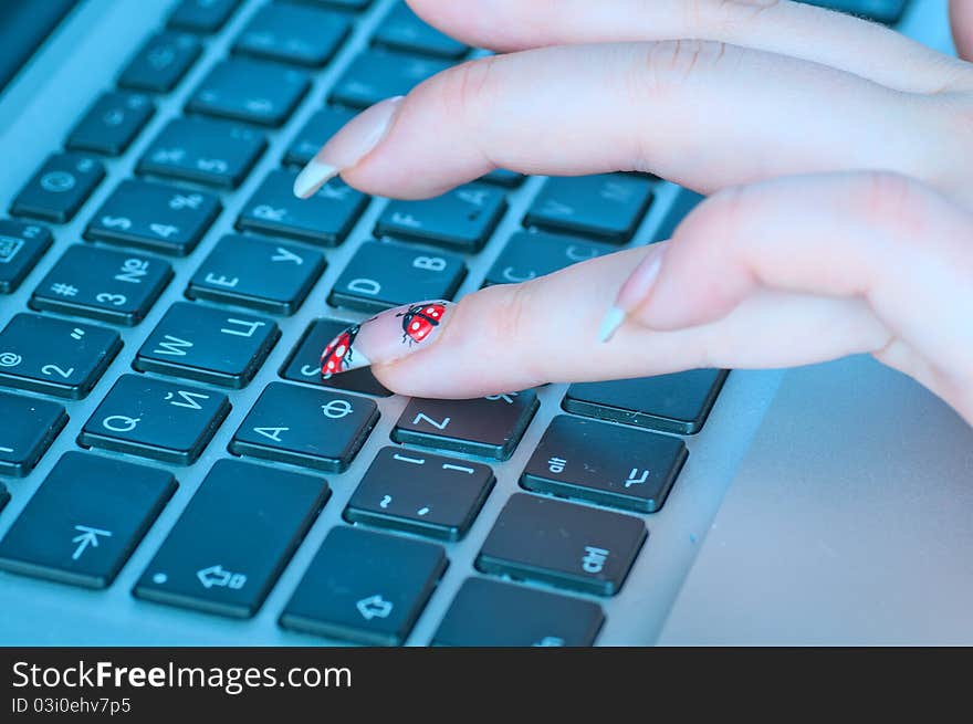 The businesswoman works at the computer at office