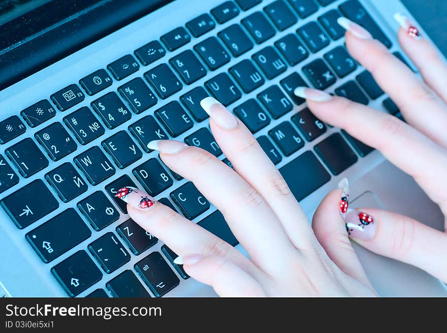 The businesswoman works at the computer at office