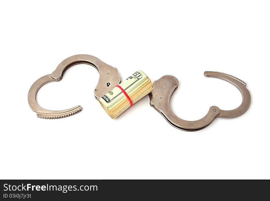 Handcuffs and dollars on a white background