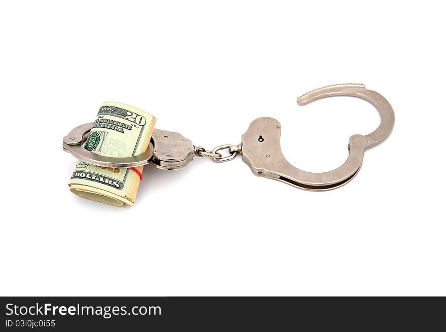 Handcuffs and dollars on a white background