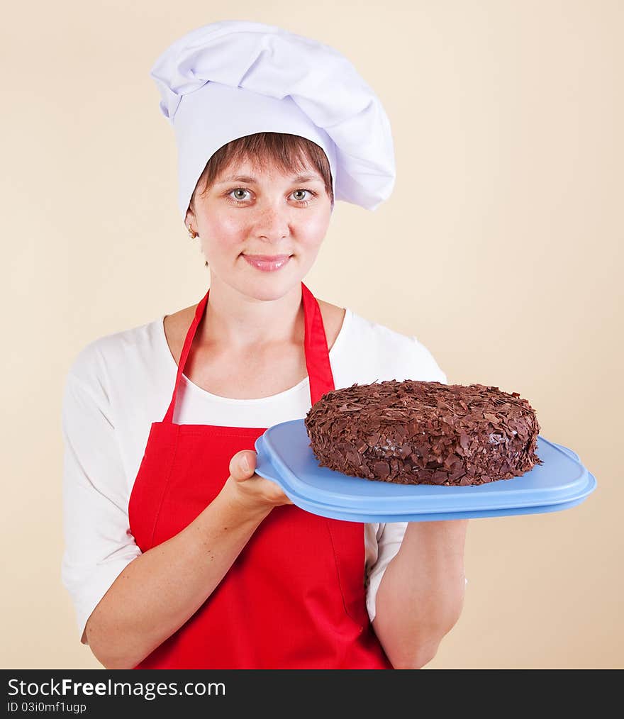 Girl chef with a cake