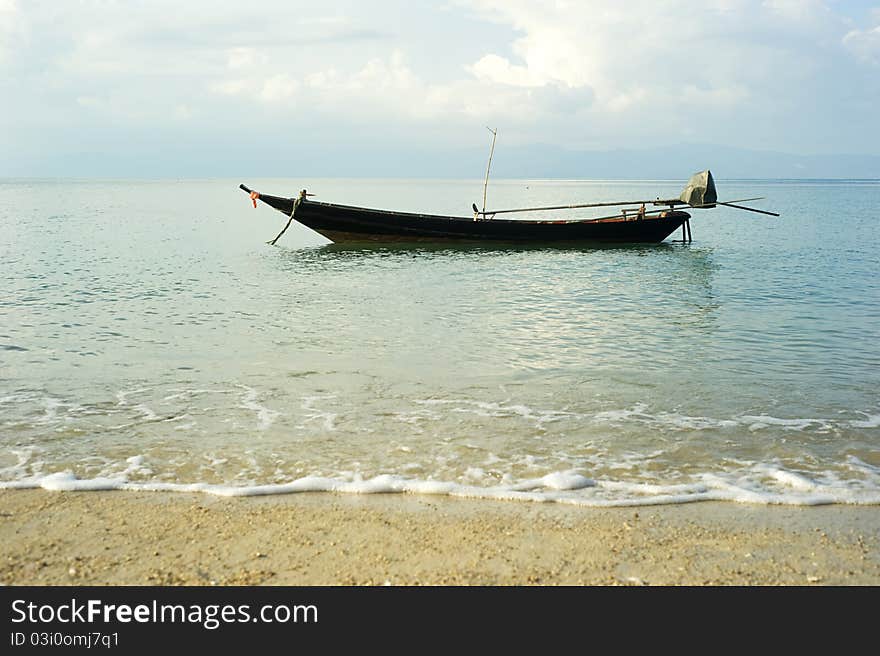 Traditional thailand boat  in the sea at sunrise