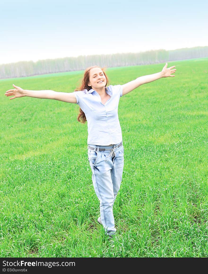 Girl walks in the field