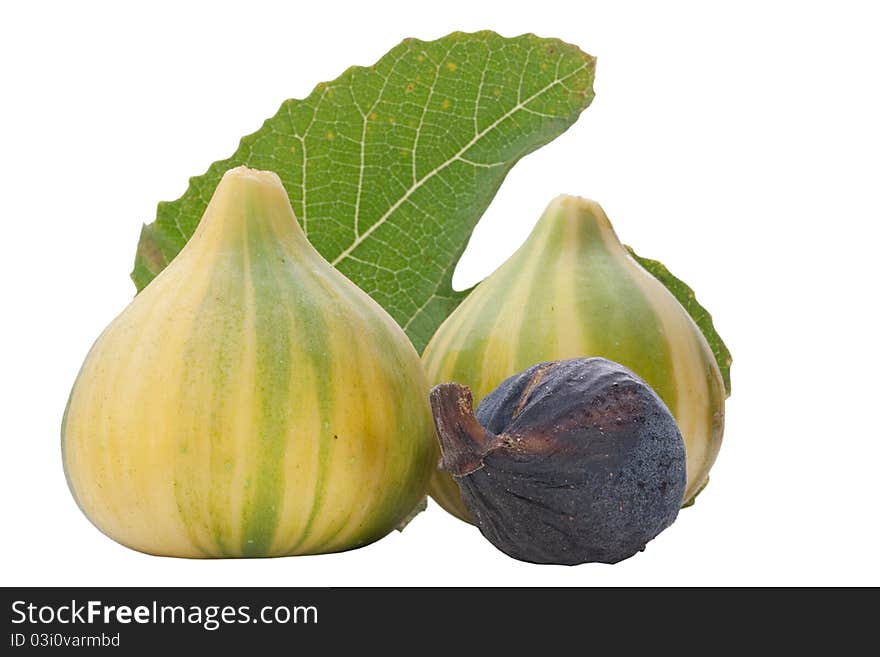 Ripe fruits of a fig on a white surface.