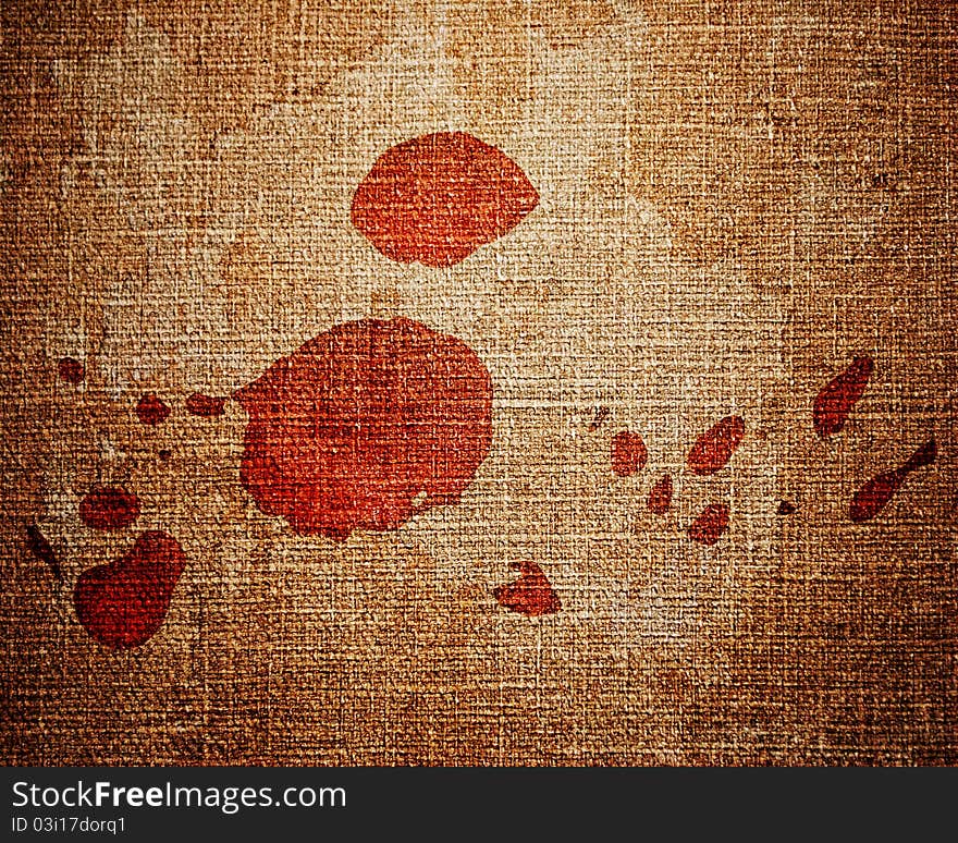 Close up of red paint drops on canvas background