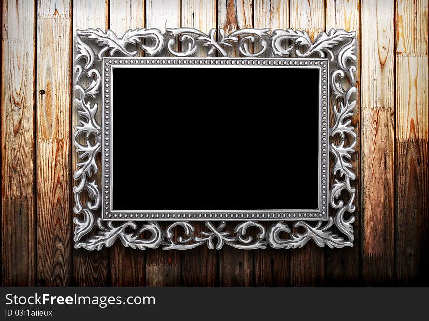 Frame on a dark wooden background. Frame on a dark wooden background