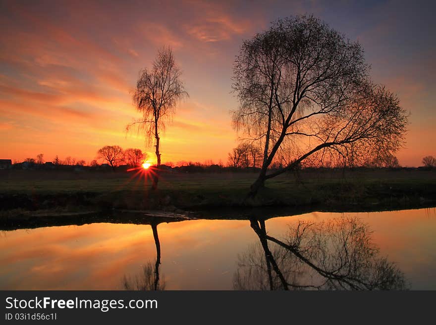 Sunset on the river bank